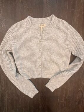 Jessica Simpson brand cardigan features delicate faux-pearl buttons